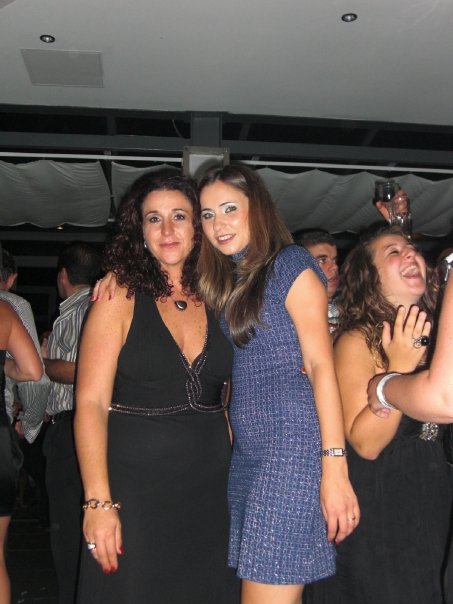 Magistrate Scerri Herrera embraces Lydia Abela, daughter-in-law of the chairman of the Commission for the Administration of Justice, at her 45th birthday party.