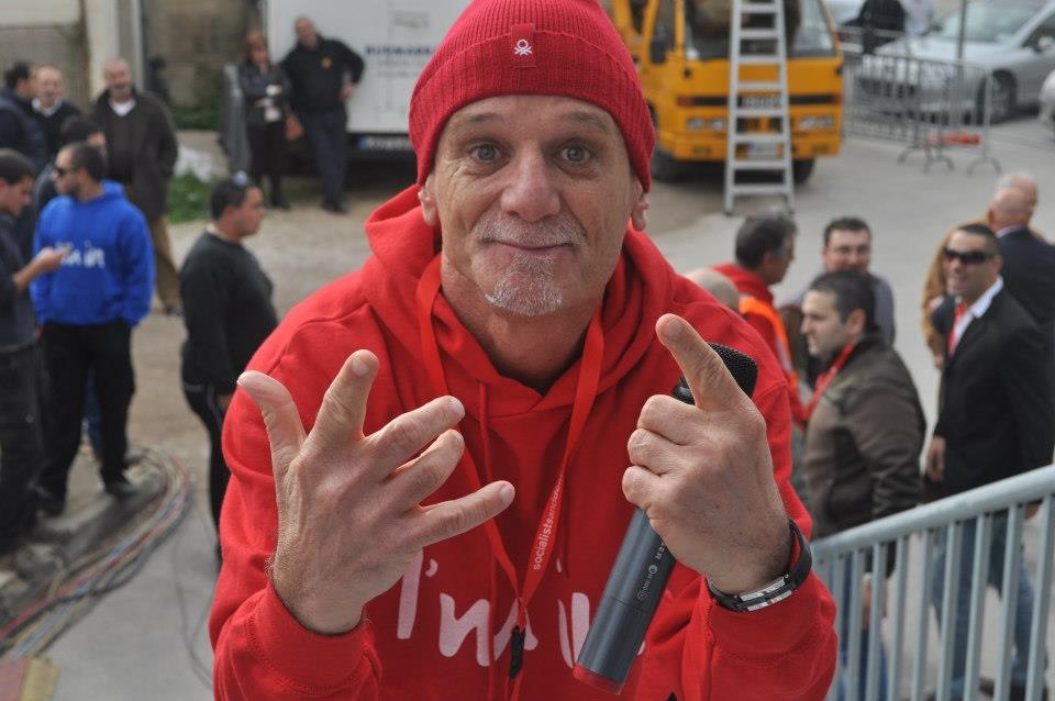 Joe Tanti, a radio DJ popular in the early 1990s, in top-to-toe red at Labour's mass meeting. If he's in, then...