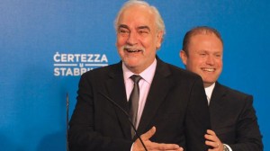 Louis Grech and Joseph Muscat laughing at the thought of all that's up for grabs