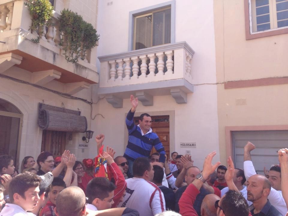 The new Law Reform Commissioner and Chief of Constitutional Reform, celebrating the Labour victory in his village on March 10.
