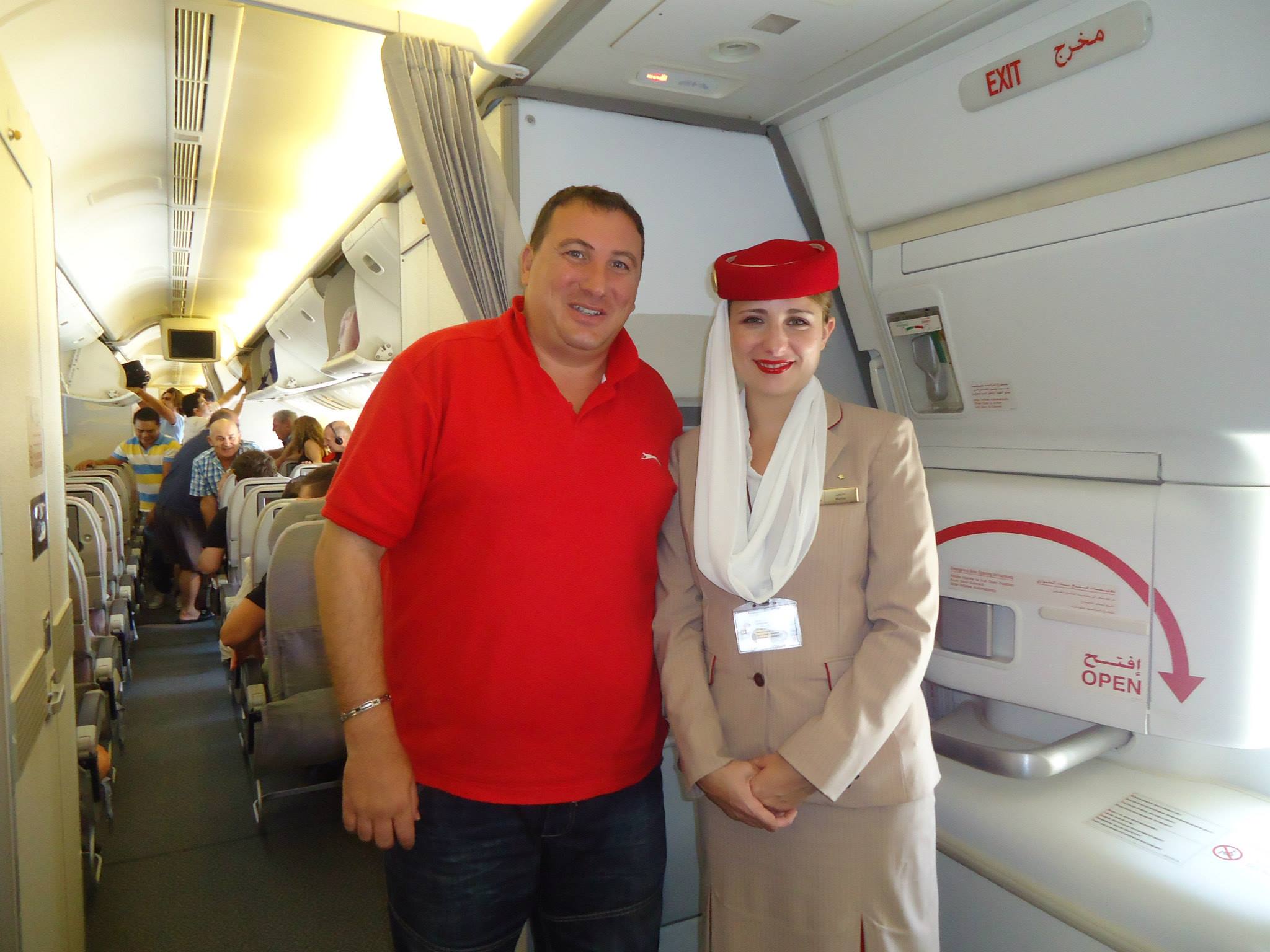 The mayor of Zurrieq is so thrilled to be on a plane that he has his picture taken with an air hostess and uploads it to Facebook.