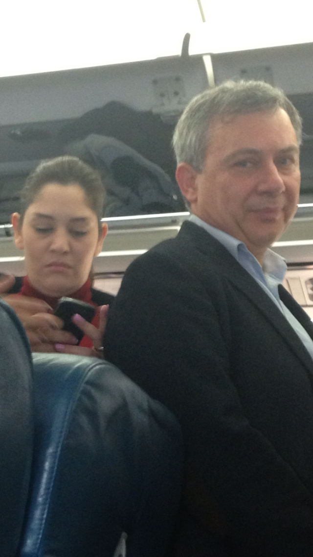 One of the photographs to which the executive chairman of the Malta Council for Science and Technology objected - showing him on a flight to London with his then 'personal assistant' Lara Boffa.