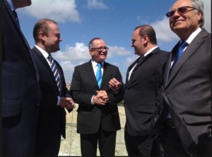 Bank of Valletta chairman John Cassar White, centre, with the prime minister, and ministers Chris Cardona and Edward Scicluna