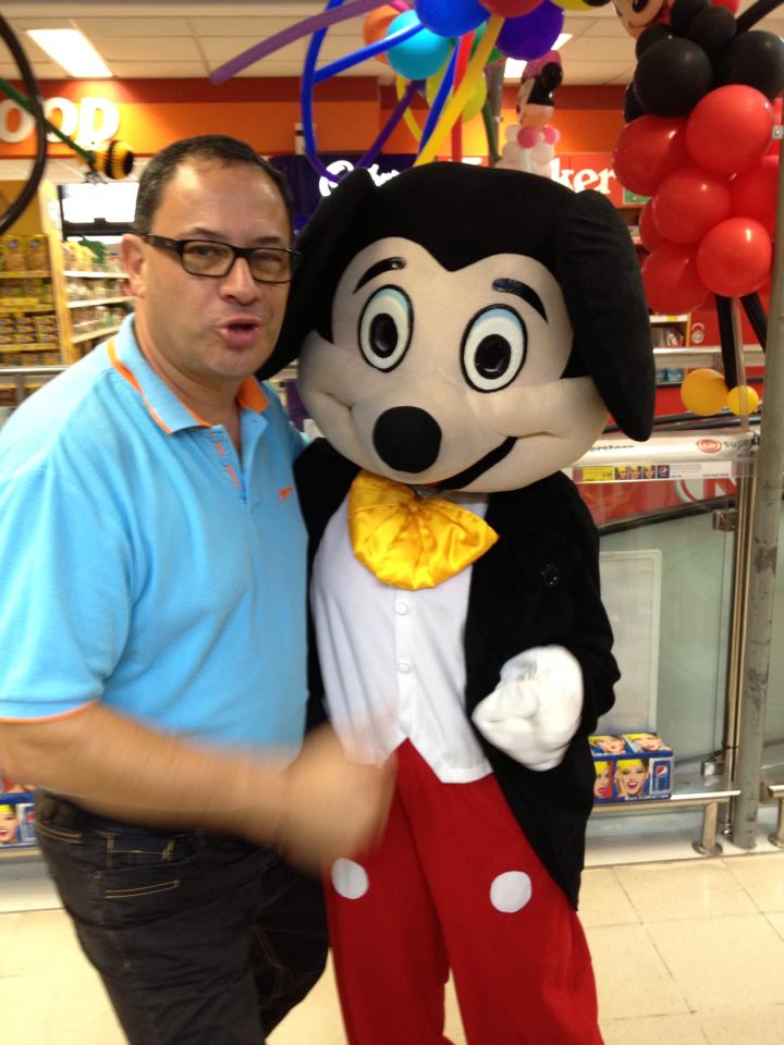 Meanwhile, her husband appears to be giving Mickey Mouse a hand job. 
