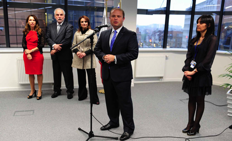Joseph Muscat speaking to staff at Dar Malta in Brussels: permanent representative (ambassador) Marlene Bonnici is on right; the deputy prime minister and Mrs Muscat are in the background.