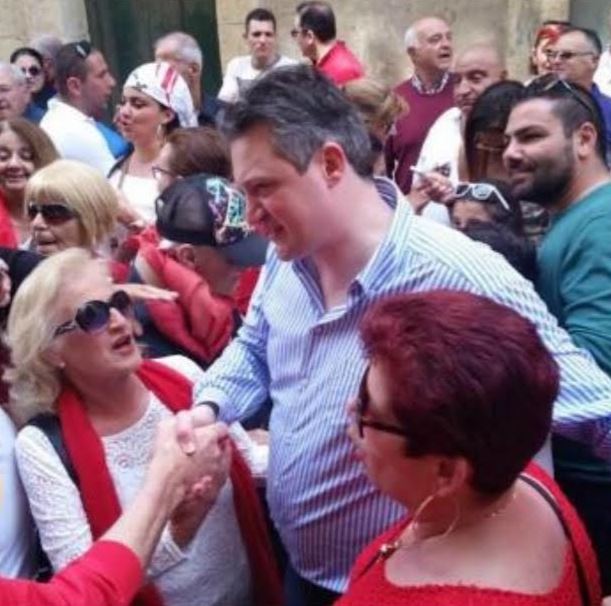 The Minister in the Office of the Prime Minister accepts the adulation of Labour Party diehard supporters at last Sunday's May Day meeting outside his office.