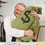 Bank Manager Hugging Bag Of Money